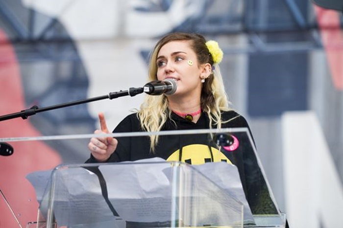 LOS ANGELES, CA - JANUARY 21: Singer Miley Cyrus speaks onstage at the women's march in Los Angeles on January 21, 2017 in Los Angeles, California. Emma McIntyre/Getty Images/AFP